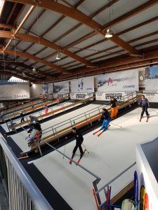 Revolving treadmill ski slopes