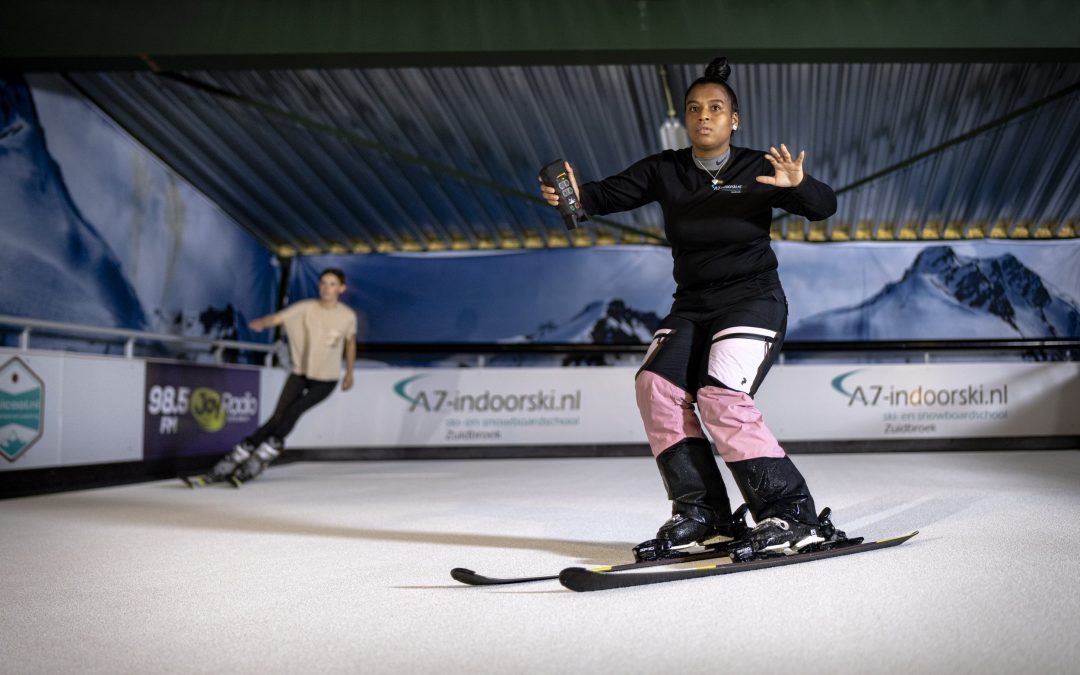 Skiing on a indoor ski simulator