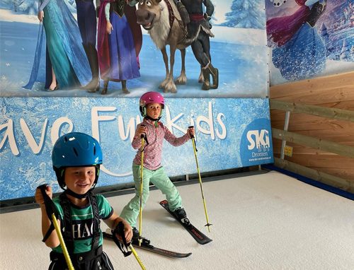 kids on a portable ski machine